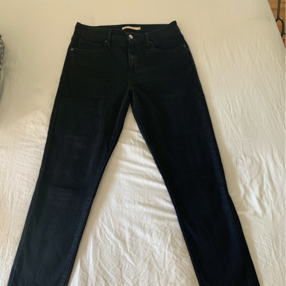 Levi high-rise skinny black jeans. Raw hem